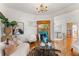 Living room with hardwood floors, fireplace, and view into dining area at 649 S Pearl St, Denver, CO 80209