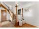 Grand staircase with ornate wood detailing, leading to the upper level at 649 S Pearl St, Denver, CO 80209