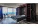 Bedroom with a built-in murphy bed and city views at 1020 15Th St # 40M, Denver, CO 80202