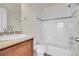 Clean bathroom with a tub, shower, and updated vanity at 10108 E 31St Ave, Denver, CO 80238