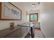 Bright laundry room with washer, dryer, and countertop space at 6929 Weasel Way, Evergreen, CO 80439