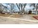 House exterior, showcasing the front yard, driveway, and landscaping at 1852 S Forest St, Denver, CO 80222