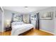 Comfortable bedroom with a king-size bed and hardwood floors at 1852 S Forest St, Denver, CO 80222