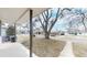 View of street from covered porch, mature trees, and quiet neighborhood at 1852 S Forest St, Denver, CO 80222