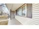 Exterior view of house, showcasing light colored siding and brown shutters at 1852 S Forest St, Denver, CO 80222