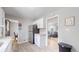 Modern kitchen with white cabinets, stainless steel appliances and view into living room at 1852 S Forest St, Denver, CO 80222