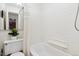 Clean bathroom with white tile and a shower/tub combo at 855 N Pennsylvania St # 407, Denver, CO 80203