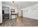 Dining area with wood floors, a console table, and kitchen view at 855 N Pennsylvania St # 407, Denver, CO 80203