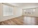 Bright living room featuring hardwood floors and large windows at 26346 E Canal Pl, Aurora, CO 80018