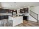 Modern kitchen with granite countertops and island at 26346 E Canal Pl, Aurora, CO 80018