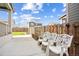 Patio with two white chairs and a view of the yard at 26346 E Canal Pl, Aurora, CO 80018