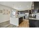 Modern kitchen with granite countertops and island at 26346 E Canal Pl, Aurora, CO 80018