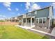 Spacious backyard with a large patio and grassy area at 26346 E Canal Pl, Aurora, CO 80018