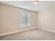 Simple bedroom with neutral walls and carpeting at 2500 E Cherry Creek South Dr # 414, Denver, CO 80209