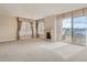 Spacious living room with fireplace and access to balcony at 2500 E Cherry Creek South Dr # 414, Denver, CO 80209