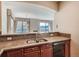 Kitchen with granite countertops, breakfast bar, and view to living area at 2500 E Cherry Creek South Dr # 414, Denver, CO 80209
