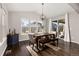 Sunlit dining area with hardwood floors and sliding door access to the patio at 12689 Sunset Dr, Longmont, CO 80504