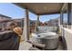 Hot tub on covered patio with surrounding backyard views at 12689 Sunset Dr, Longmont, CO 80504