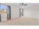 Bright bedroom with ceiling fan and balcony access at 3872 S Xanthia St, Denver, CO 80237