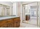 Bathroom vanity with a granite countertop and wooden cabinetry at 13901 E Marina Dr # 109, Aurora, CO 80014