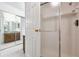 Bathroom with a shower, vanity, and mirrored closet doors at 13901 E Marina Dr # 109, Aurora, CO 80014
