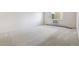Empty bedroom with carpeted flooring and a large window at 13901 E Marina Dr # 109, Aurora, CO 80014