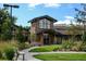 Clubhouse exterior with stone and wood accents, large windows, and a welcoming entrance at 13901 E Marina Dr # 109, Aurora, CO 80014