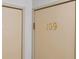 Hallway with doors leading to individual units, numbered for easy identification at 13901 E Marina Dr # 109, Aurora, CO 80014