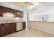 Kitchen with stainless steel appliances, wood cabinets, and tile floor at 13901 E Marina Dr # 109, Aurora, CO 80014