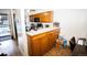 Kitchen features a breakfast bar and wood cabinets at 8773 W Cornell Ave # 7, Lakewood, CO 80227