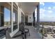 Spacious balcony with city views, chairs, and a grill at 7600 Landmark Way # 1107, Greenwood Village, CO 80111