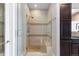 Elegant shower with tiled walls and built-in shelving at 7600 Landmark Way # 1107, Greenwood Village, CO 80111