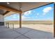 Relaxing covered porch with stunning views of open fields at 7340 Van Sickle St, Strasburg, CO 80136