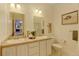 Double vanity bathroom with a view of the living room at 35100 E 120Th Ave, Hudson, CO 80642