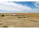 Open land with wooden fence and outbuildings at 35100 E 120Th Ave, Hudson, CO 80642