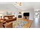 Spacious living room featuring a fireplace and hardwood floors at 35100 E 120Th Ave, Hudson, CO 80642