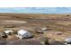 Aerial view of a small house on a large lot of land at 35100 E 120Th Ave, Hudson, CO 80642
