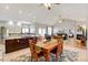 Open concept dining area with hardwood floors and view to kitchen at 35100 E 120Th Ave, Hudson, CO 80642