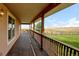 Covered deck overlooking expansive property views at 35100 E 120Th Ave, Hudson, CO 80642