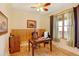 Home office with wood floors and built-in shelving at 35100 E 120Th Ave, Hudson, CO 80642