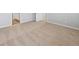 Spacious bedroom with neutral carpeting and access to a bathroom at 2224 Alyssa St, Fort Lupton, CO 80621
