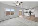 Open living room features a view of the kitchen and access to the backyard at 2224 Alyssa St, Fort Lupton, CO 80621