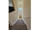 View from upper level down staircase to entrance at 14167 Sun Blaze # C, Broomfield, CO 80023