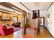 Grand entryway with hardwood floors, built-in bench, and staircase at 805 Gaylord St, Denver, CO 80206