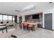 Community room with kitchen, seating, and large screen TV at 3093 Belay Pt, Castle Rock, CO 80108