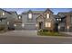 Two-story home with stone and siding exterior and two-car garage at 3093 Belay Pt, Castle Rock, CO 80108