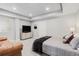 Basement bedroom with a comfy bed and sitting area at 3093 Belay Pt, Castle Rock, CO 80108