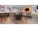 Finished basement recreation room with large screen TV, seating area, and game tables at 3093 Belay Pt, Castle Rock, CO 80108