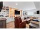Finished basement recreation room with a large TV and comfortable seating at 3093 Belay Pt, Castle Rock, CO 80108