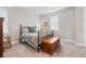 Cozy bedroom with a metal bed frame and ample floor space at 3093 Belay Pt, Castle Rock, CO 80108